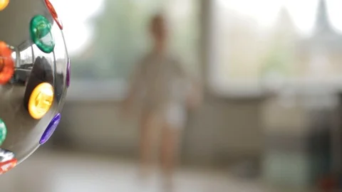 Toddler dancing behind discoball 스톡 동영상 129679736