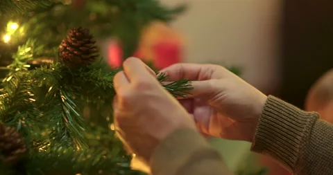 Toddler decorating christmas tree Stock Footage 143712490
