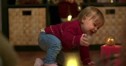 Toddler decorating christmas tree Stock Footage 143712678