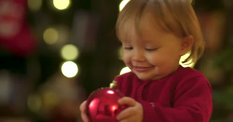 Toddler decorating christmas tree Stock Footage 143712895