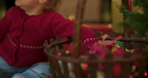 Toddler decorating christmas tree Stock Footage 143713105