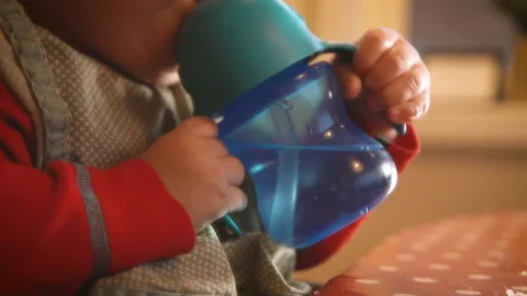 Toddler drinking water Stock Footage 203975709