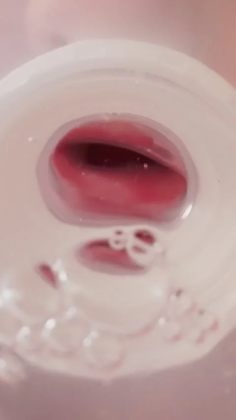 Toddler drinks clear water from bottle using silicone nipple Stock Footage 307461402