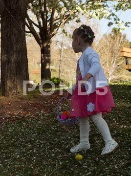 Toddler on easter egg hunt Stock Photos