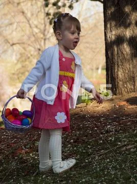 Toddler on easter egg hunt Stock Photos