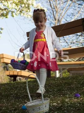 Toddler on easter egg hunt Stock Photos