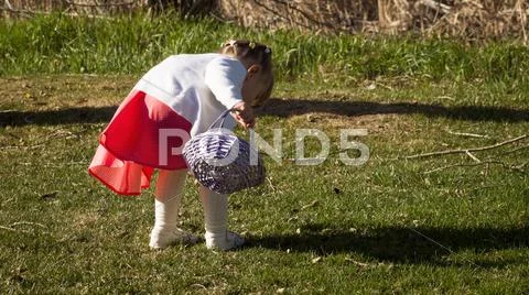 Toddler on easter egg hunt Stock Photos
