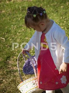 Toddler on easter egg hunt Stock Photos