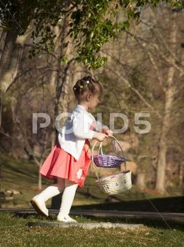 Toddler on easter egg hunt Stock Photos
