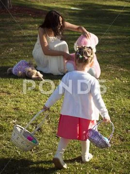 Toddler on easter egg hunt Stock Photos