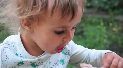 Toddler eating with a spoon Stock Footage 11344118