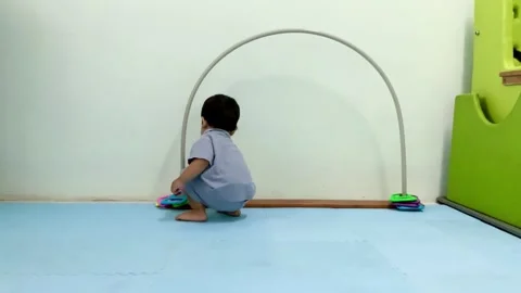 Toddler Engaging in Therapeutic Motor Development Play Vídeo Stock 341498458