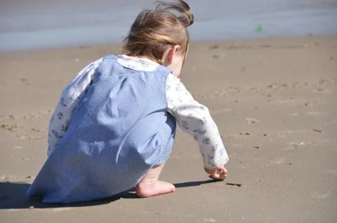 Toddler Exploring the Beach Stock Photos
