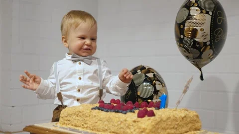 Toddler first birthday cake Stock Footage 336218459