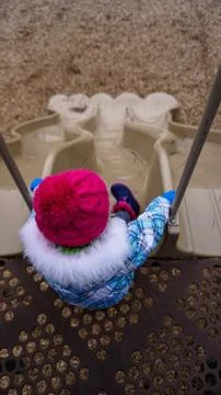 Toddler Going Down Slide Stock Photos