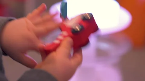 Toddler Hands Spinning Propeller Of Red Wooden Toy Helicopter In Close Up Stock Footage 330192803