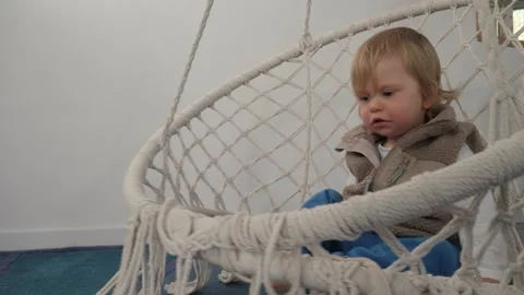 Toddler hanging swing Stock Footage 303498481