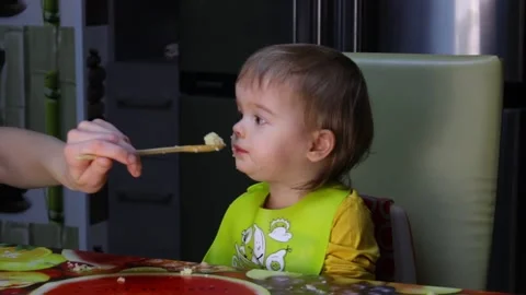 Toddler having lunch Stock Footage 146165776