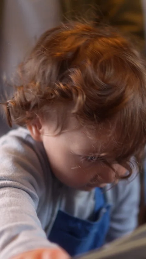 Toddler holding folded stroller during passenger train journey, highlightin.. Stock Footage 338170487