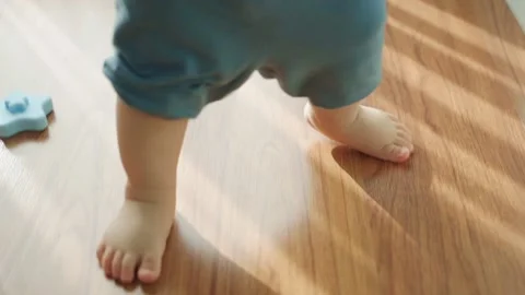 Toddler learning how to walk Video stock 210745573