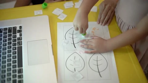 Toddler learning to use glue for her creation Stock Footage 159056255