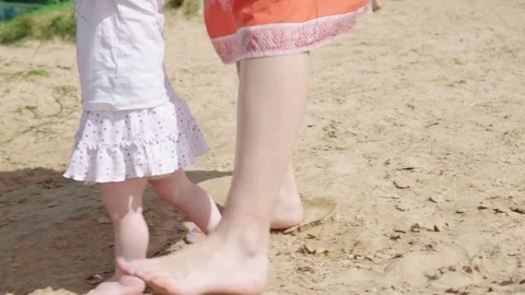 Toddler learning to walk Stock Footage 78596085
