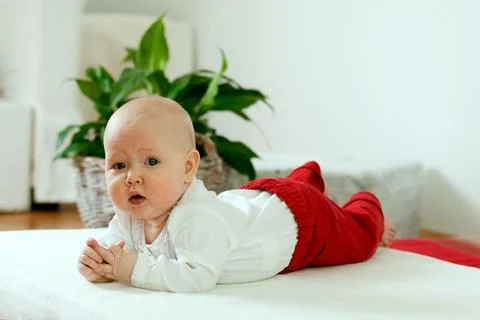 Toddler learns to crawl Stock Photos