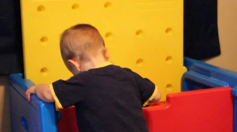 Toddler looking in a toy box Stock Footage 44444692