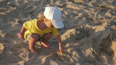 Toddler playing at beach Stock Footage 300905270