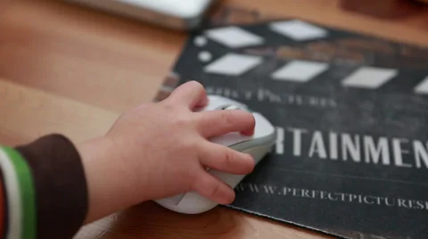 Toddler playing with a computer mouse Stock Footage 32821073