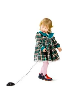 Toddler playing with a computer mouse Fotos Stock