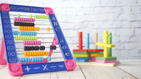 Toddler playing with counting math learning toy . Stock Footage 155104512