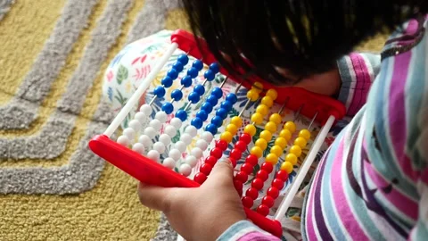 Toddler playing with counting math learning toy . Stock Footage 237639171