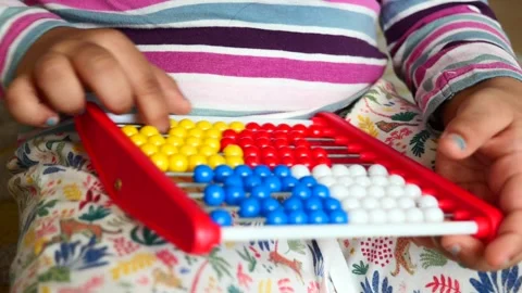 Toddler playing with counting math learning toy . Stock Footage 246453675