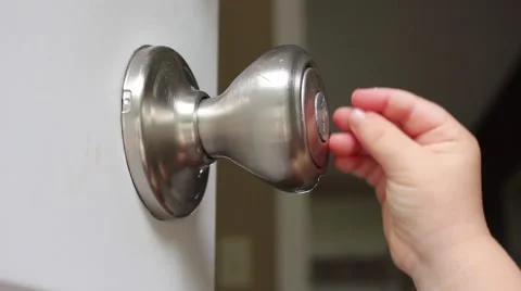 Toddler playing with doorknob Stock Footage 41737549