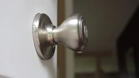 Toddler playing with doorknob Stock Footage 41737551
