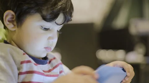 Toddler playing on his tablet Stock Footage 59104190
