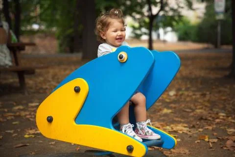 Toddler playing park Stock Photos