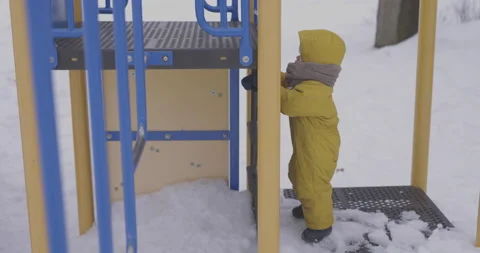 Toddler playing at the park in winter time Stock-Footage 150377794