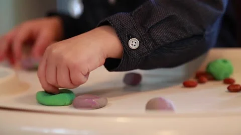 Toddler playing with plasticine, hands, close up Stock Footage 58074518
