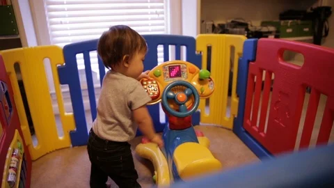 Toddler Playing in Playpen Stock Footage 94071461