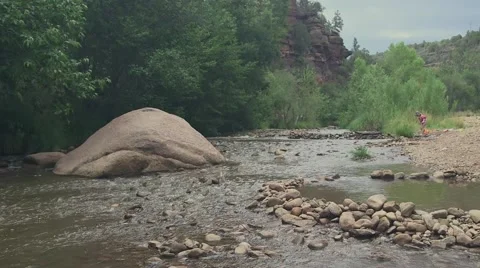 Toddler playing in riverbed 04 Stock Footage 43386593