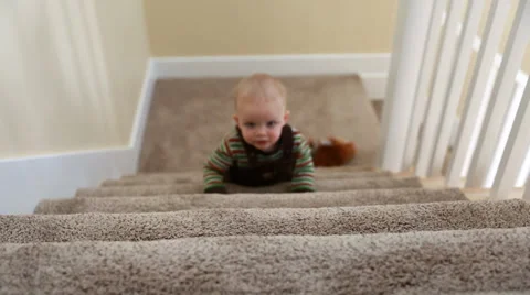 Toddler playing on stairs Stock Footage 34663203