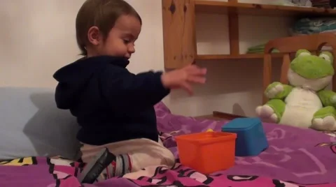 Toddler plays with pyramid items 3, Crystal child Stock Footage 48967470