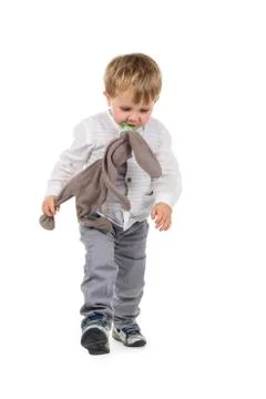 Toddler with plush animal and pacifier Stock Photos