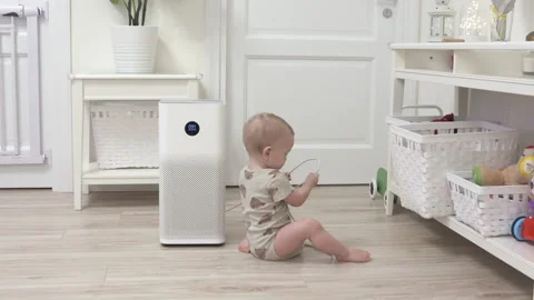 Toddler pulls the electric plug out of socket, 1 year old infant playing with Stock Footage 172043035