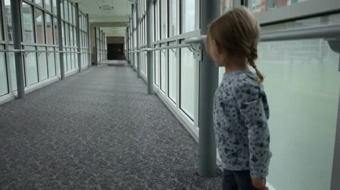 Toddler running down a hallway Stock Footage 34437651