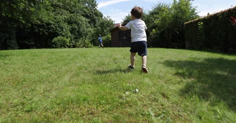 Toddler running in the garden  Stock-Footage 65170486