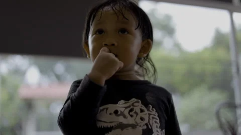 Toddler Standing And Looking At Something Intently Stock Footage 335690287