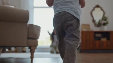 Toddler standing up and taking first steps toward mother with joy Video stock 316581928